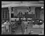 Herbert Aptheker speaking at church meeting, California Labor School