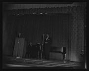 Paul Robeson on stage with man at piano, California Labor School