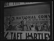 Woman at microphone and panel of men at FTA 7th National Convention, California Labor School