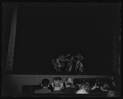 Three Southeast Asian performers on stage, California Labor School