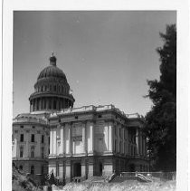 Exterior view of the California State Capitol grounds during upgrades to the sidewalks and walkways. This view is looking before the demolition of the apse or center section