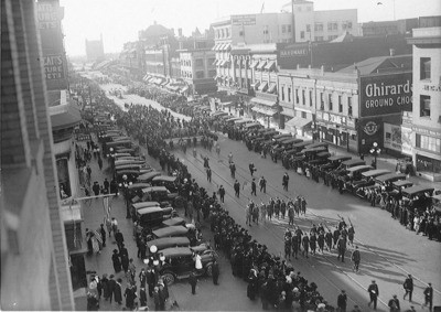 European War, 1914-1918 - Stockton: Victory Parade of soldiers and citizens during ""flu"" epidemic at the end of World War I, Stockton Photo Engraving Co., Harry McCabe, Belding Building Institute of Law, P.H. Stitt Real Estate, E. Weber St