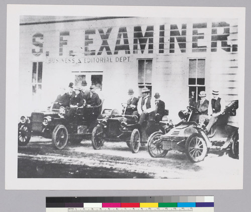 People in automobiles in front of the San Francisco Examiner Business and Editorial Department building