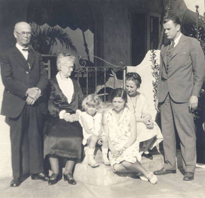 Chapman family group on porch, New Year's Day, 1929-1930