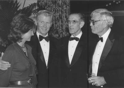 Cecilia and Randall Presley, Irvin C. "Ernie" Chapman, and C. James Beneley at a Chapman College event in 1983