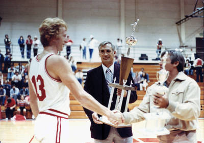 Bob Hamblin and LeRoy Stevens present the Perkins Hall of Fame trophy to Rusty Owens