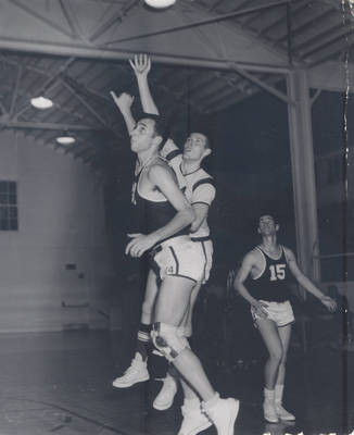 Basketball game in "The Box" [gym], Chapman College, Orange, California. The gym was constructed in 1926 and torn down in 1976