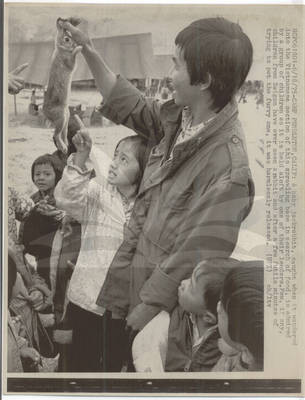 Refugee Children Admire Rabbit