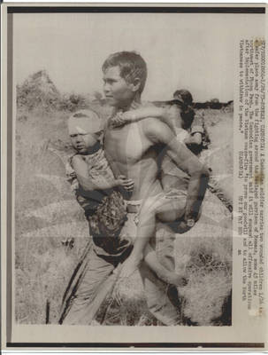 Cambodian Soldier Carries Wounded Children