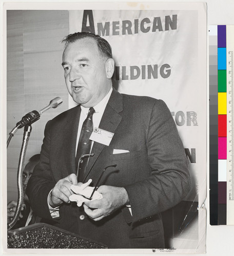 Governor Edmund G. Brown speaking into a microphone