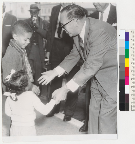 Governor Edmund G. Brown with two African American children during gubernatorial campaign in Los Angeles