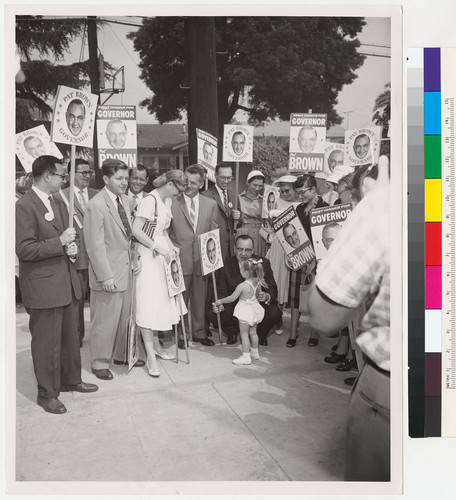 Edmund G. Brown speaking to a little girl at a campaign rally