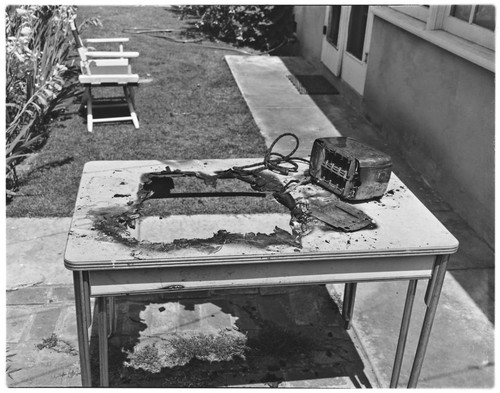 Burned electric toaster on table — Calisphere