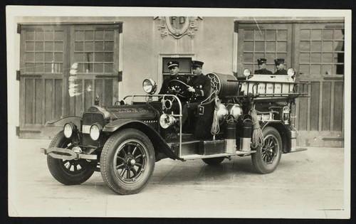 Squad No. 1, B Platoon - 'White' on ladder truck in front of old Station No. 6, 1355 W. 1st St