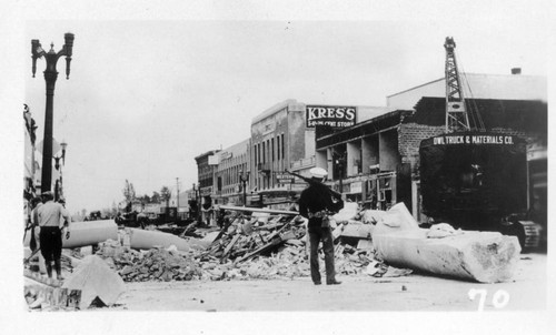 Soldier guarding Compton street after earthquake