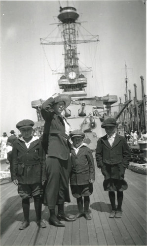 Charley Emerson, Helen Buss, Ernest Buss (nephew), and Claude Emerson onboard the battleship New York at San Pedro Harbor, California