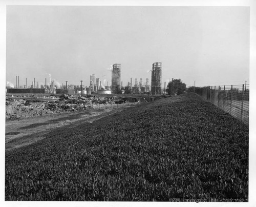 Oil refinery near trash dump