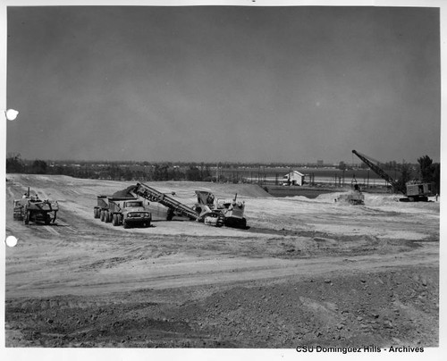 Heavy machines moving dirt