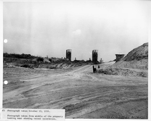 Oil towers near sand