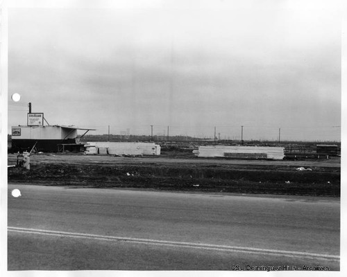 Planks piled at construction site, General American Transportation Building