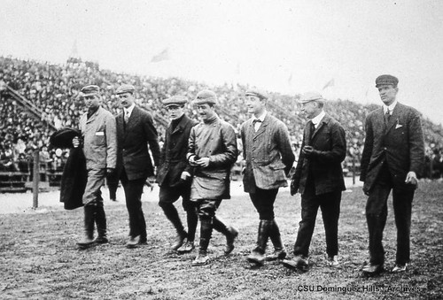 Aviators walking down track