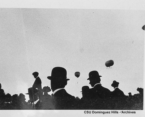 Balloons in flight beyond spectators