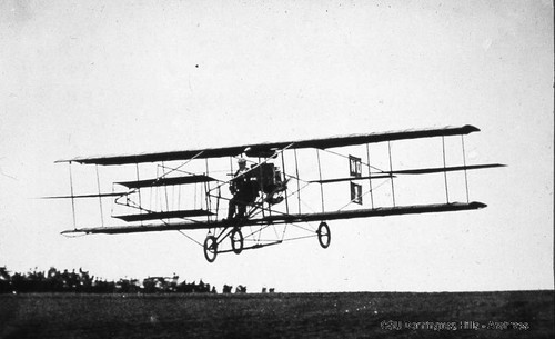 Charles Willard flying Curtiss biplane