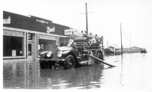 Hose truck on flooded street