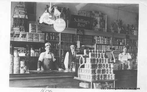 Roy behind the counter at a general store