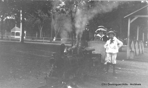 Family in miniature train