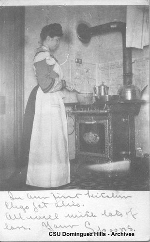 Mimetta cooking at a stove