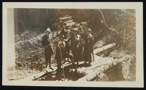 Five adults standing outside