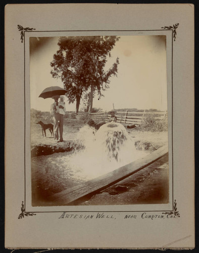 Bazil Rozelle with children by ranch well