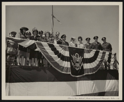 Women and officers on ship during launch party