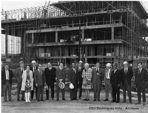 Administrators and visitors at library construction site