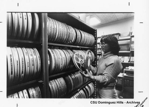 Student with film canisters