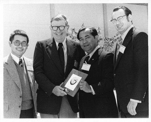 Leo Cain accepts City of Gardena Plaque