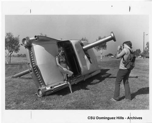 Students pose at automobile installation