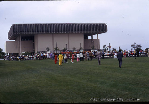 Audience gathering for graduation assembly