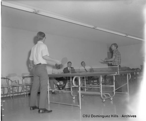 Students playing table tennis