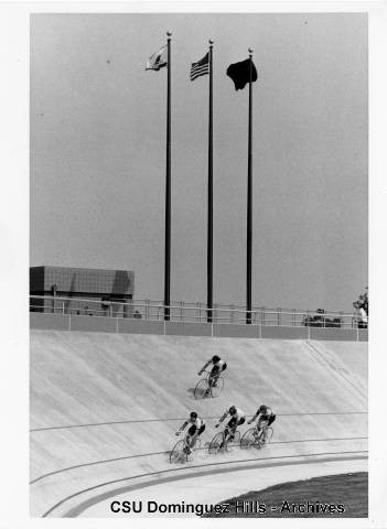 Riders training beneath Olympic flags