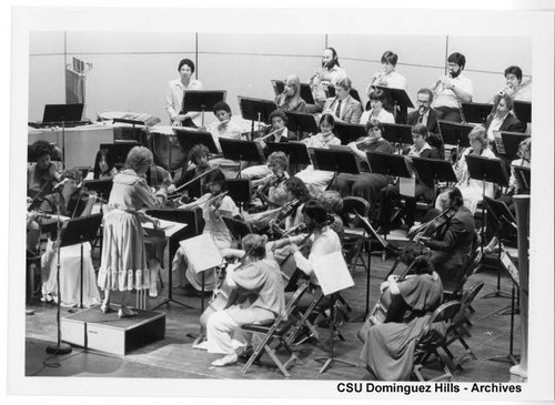 Dr. Frances Steiner leading orchestra