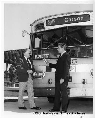 President Gerth with Carson RTD bus on Campus