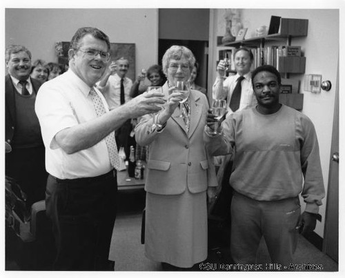 Dominguez Hills Faculty and Staff toast with wine glasses