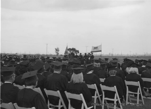 Graduates listening to speaker at commencement