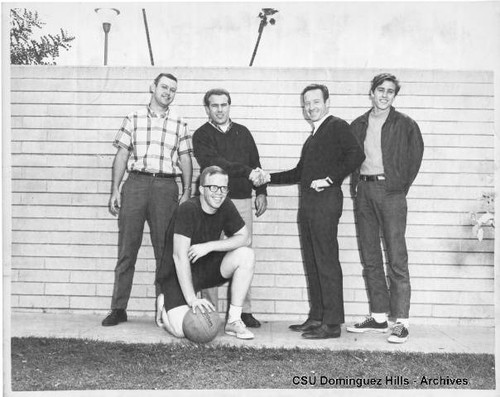 Physical Education instructor with intramural basketball winners