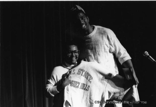 Magic Johnson with CSUDH sweatshirt