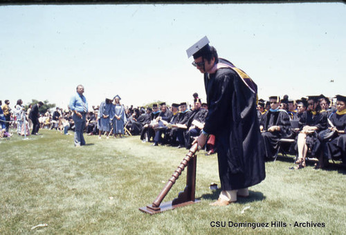 Dr. Bialosky placing graduation baton