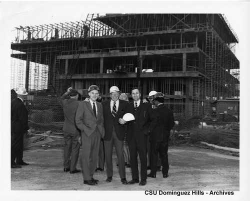 Administrators and visitors at library construction site