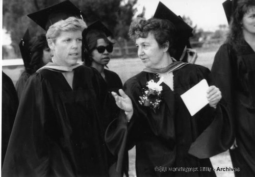 Graduates chatting in line